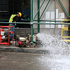 A worker pumps water out of a subway line near Wall St. in lower Manhattan. Photo: WarmSleepy/Flickr
