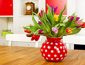 Photo of a beautiful vase of spring tulips by IvonneW/istockphoto.com.