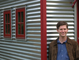 Jay Shafer in front of one of his designs. Photo by Janine Borgenson. Used with permission from Tumbleweed Tiny House Company.