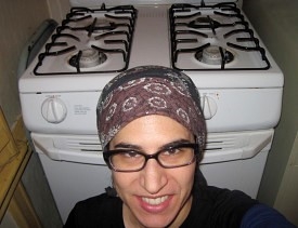 Here is a charming self-portrait taken in front of my freshly cleaned range, right after I cleaned it with toothpaste.