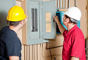 electricians at electrical panel