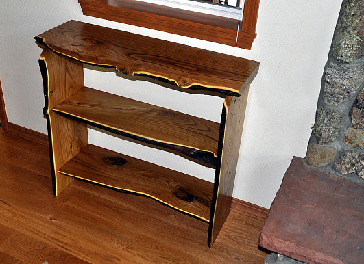 A native edge wood book case made by the author.