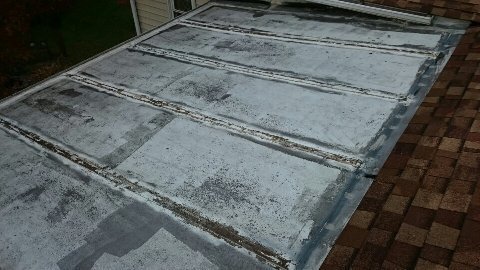 Before: damaged sunroom roof