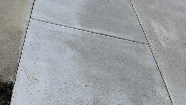 Closeup of new concrete sidewalk