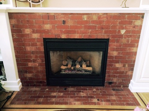 Fireplace with brickwork surround and hearth