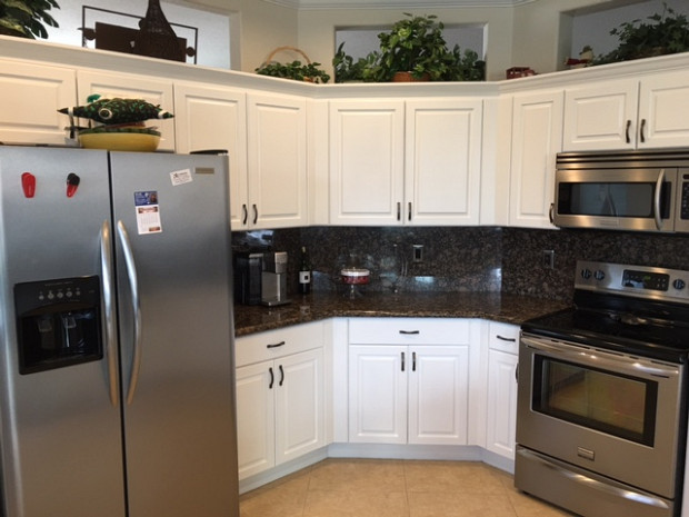 After: White painted cabinets brighten the whole kitchen